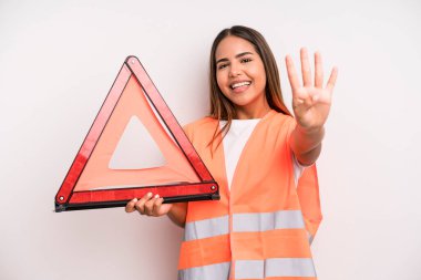 hispanic pretty woman smiling and looking friendly, showing number four. car accident emergency concept