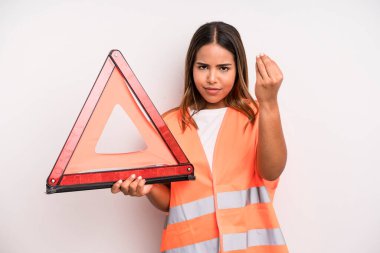 hispanic pretty woman making capice or money gesture, telling you to pay. car accident emergency concept