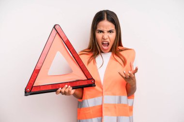 hispanic pretty woman looking angry, annoyed and frustrated. car accident emergency concept