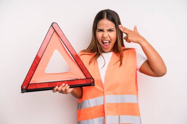 hispanic pretty woman looking unhappy and stressed, suicide gesture making gun sign. car accident emergency concept