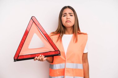 hispanic pretty woman feeling sad and whiney with an unhappy look and crying. car accident emergency concept