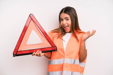 hispanic pretty woman feeling happy, surprised realizing a solution or idea. car accident emergency concept