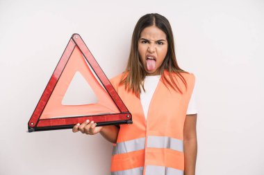 hispanic pretty woman feeling disgusted and irritated and tongue out. car accident emergency concept