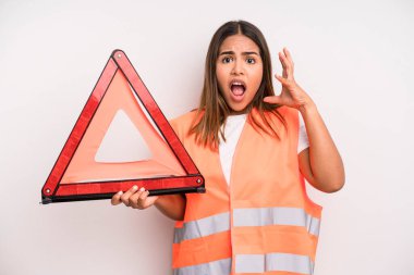 hispanic pretty woman screaming with hands up in the air. car accident emergency concept