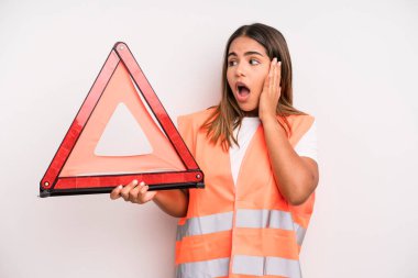 hispanic pretty woman feeling happy, excited and surprised. car accident emergency concept