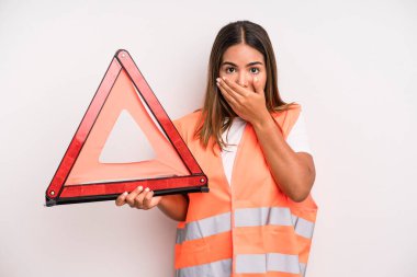 hispanic pretty woman covering mouth with hands with a shocked. car accident emergency concept