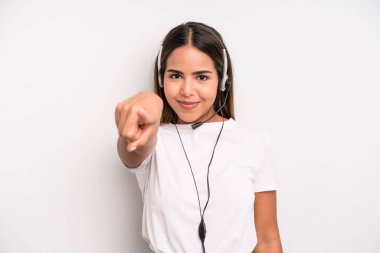 hispanic pretty woman pointing at camera choosing you. telemarketer concept