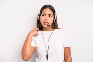 hispanic pretty woman feeling stressed, anxious, tired and frustrated. telemarketer concept