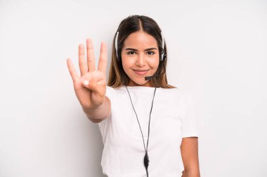 hispanic pretty woman smiling and looking friendly, showing number four. telemarketer concept