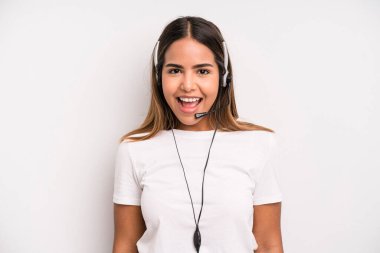 hispanic pretty woman looking happy and pleasantly surprised. telemarketer concept