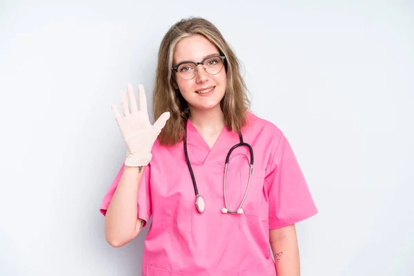 Caucasian Pretty Woman Smiling Looking Friendly Showing Number Four Nurse — Stok fotoğraf