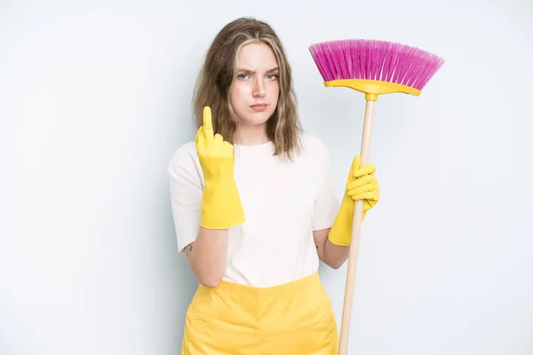 caucasian pretty woman feeling angry, annoyed, rebellious and aggressive. housekeeper cleaning concept