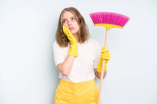 caucasian pretty woman feeling bored, frustrated and sleepy after a tiresome. housekeeper cleaning concept