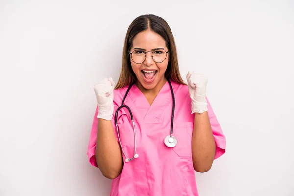 Hispanic Pretty Woman Feeling Shocked Laughing Celebrating Success Medicine Student — Zdjęcie stockowe