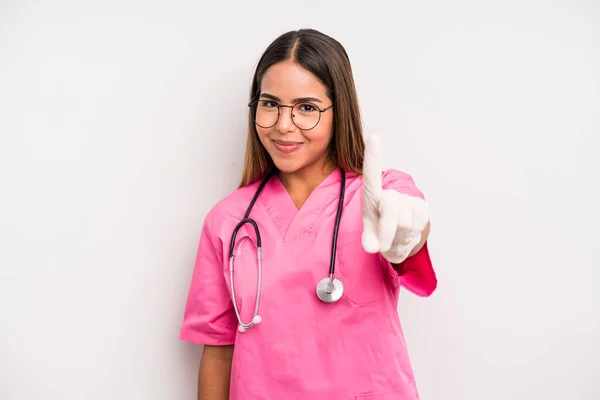Hispanic Pretty Woman Smiling Proudly Confidently Making Number One Medicine — Stockfoto