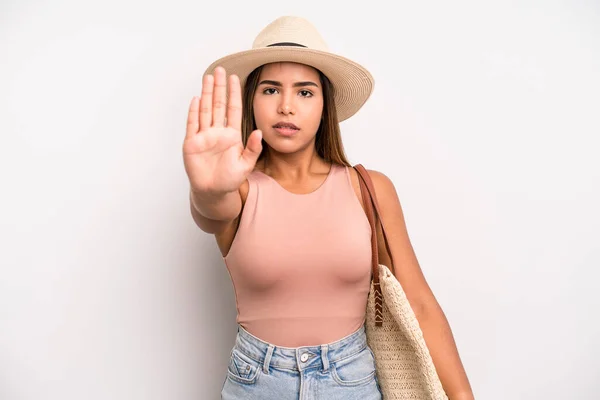 Hispanic Pretty Woman Looking Serious Showing Open Palm Making Stop — Fotografia de Stock