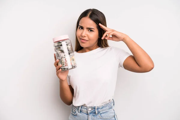 Hispanic Pretty Woman Feeling Confused Puzzled Showing You Insane Dollar — Stockfoto