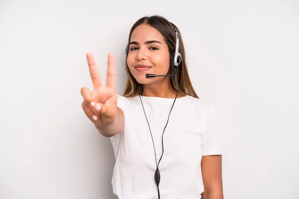 Hispanic Pretty Woman Smiling Looking Friendly Showing Number Two Telemarketer — Fotografia de Stock