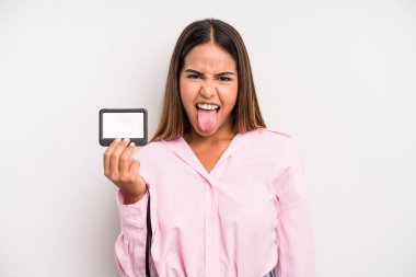 hispanic pretty woman with cheerful and rebellious attitude, joking and sticking tongue out. pass id card concept