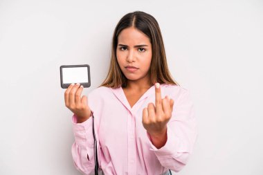 hispanic pretty woman feeling angry, annoyed, rebellious and aggressive. pass id card concept