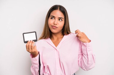 hispanic pretty woman looking arrogant, successful, positive and proud. pass id card concept