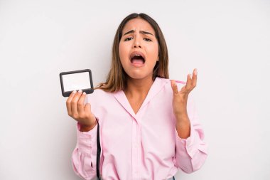 hispanic pretty woman looking desperate, frustrated and stressed. pass id card concept