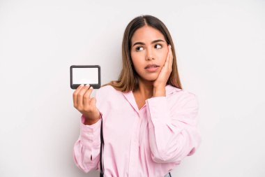 hispanic pretty woman feeling bored, frustrated and sleepy after a tiresome. pass id card concept