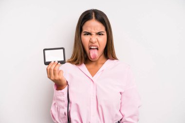 hispanic pretty woman feeling disgusted and irritated and tongue out. pass id card concept