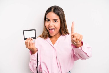 hispanic pretty woman feeling like a happy and excited genius after realizing an idea. pass id card concept