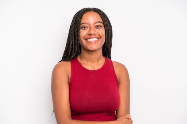 black young adult woman laughing shyly and cheerfully, with a friendly and positive but insecure attitude