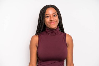 black young adult woman smiling positively and confidently, looking satisfied, friendly and happy