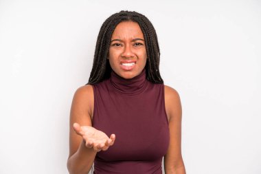 black young adult woman looking angry, annoyed and frustrated screaming wtf or whats wrong with you 