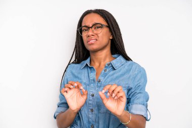 black young adult woman feeling disgusted and nauseous, backing away from something nasty, smelly or stinky, saying yuck