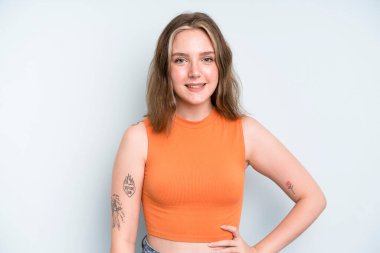 caucasian pretty woman smiling happily with a hand on hip and confident, positive, proud and friendly attitude