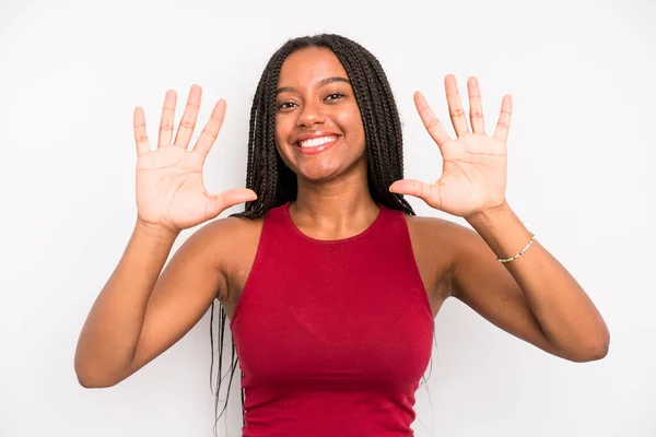 Black Young Adult Woman Smiling Looking Friendly Showing Number Ten — Stockfoto