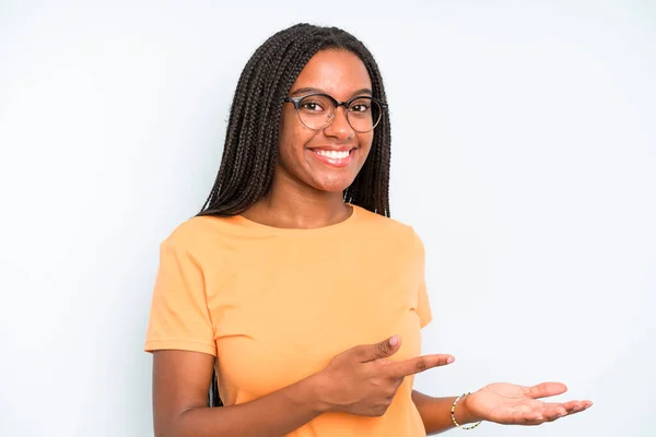 Black Young Adult Woman Smiling Feeling Happy Carefree Satisfied Pointing — Stockfoto