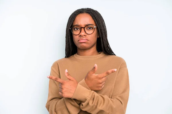 Black Young Adult Woman Looking Puzzled Confused Insecure Pointing Directions —  Fotos de Stock