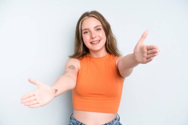 caucasian pretty woman smiling cheerfully giving a warm, friendly, loving welcome hug, feeling happy and adorable
