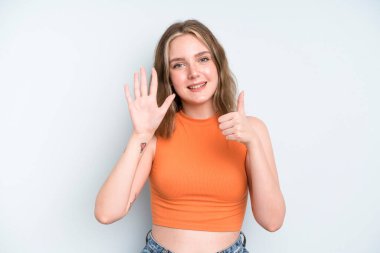 caucasian pretty woman smiling and looking friendly, showing number six or sixth with hand forward, counting down