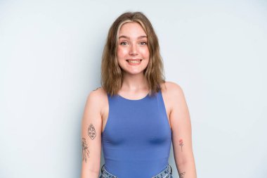 caucasian pretty woman looking happy and goofy with a broad, fun, loony smile and eyes wide open