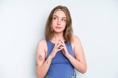 caucasian pretty woman scheming and conspiring, thinking devious tricks and cheats, cunning and betraying