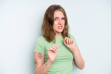 caucasian pretty woman feeling disgusted and nauseous, backing away from something nasty, smelly or stinky, saying yuck