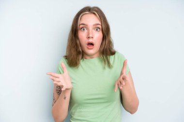 caucasian pretty woman feeling extremely shocked and surprised, anxious and panicking, with a stressed and horrified look