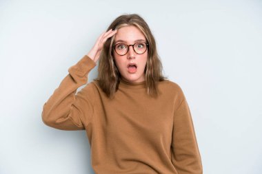 caucasian pretty woman looking happy, astonished and surprised, smiling and realizing amazing and incredible good news