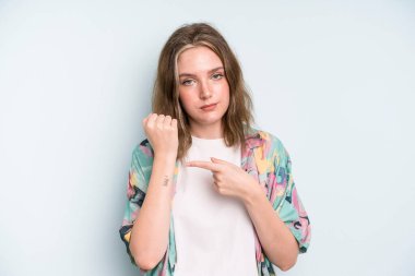 caucasian pretty woman looking impatient and angry, pointing at watch, asking for punctuality, wants to be on time