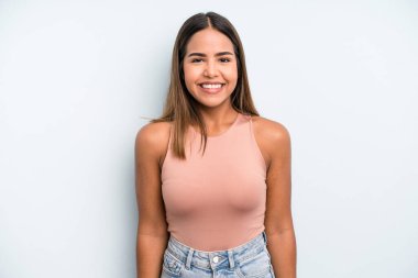 hispanic latin pretty woman looking happy and goofy with a broad, fun, loony smile and eyes wide open