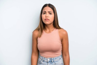 hispanic latin pretty woman feeling sad and whiney with an unhappy look, crying with a negative and frustrated attitude