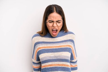 hispanic latin pretty woman shouting aggressively, looking very angry, frustrated, outraged or annoyed, screaming no