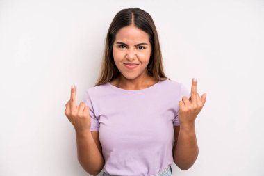 hispanic latin pretty woman feeling provocative, aggressive and obscene, flipping the middle finger, with a rebellious attitude