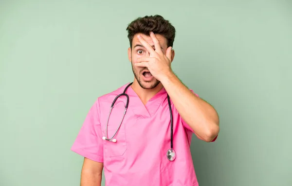 Handsome Teenager Looking Shocked Scared Terrified Covering Face Hand Nurse — Stock Photo, Image